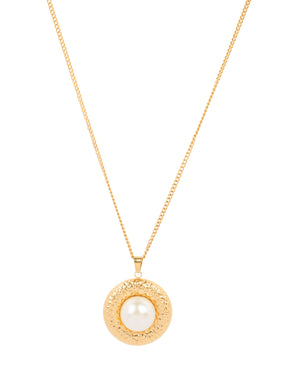 Gold chain necklace with a round hammered gold pendant featuring a large central white pearl
